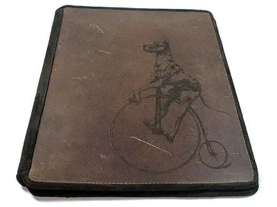 Dog on bike iPad case.webp