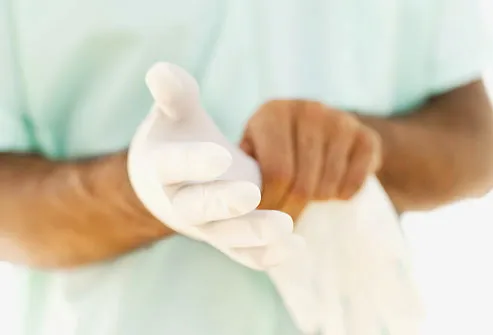 photolibrary_rf_photo_of_doctor_putting_on_gloves.jpg